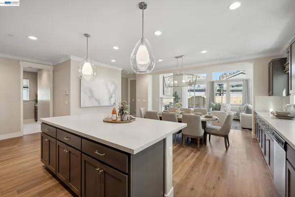 a view of a kitchen counter space dining table and chairs