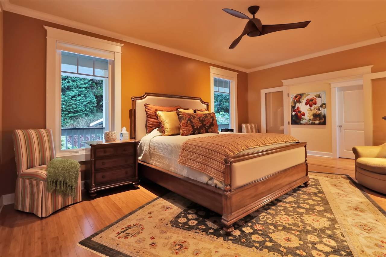 1268 Lower Kimo Drive Kula, HI 96790 - Photo 13 of 30 a bedroom with a bed wooden floor and window