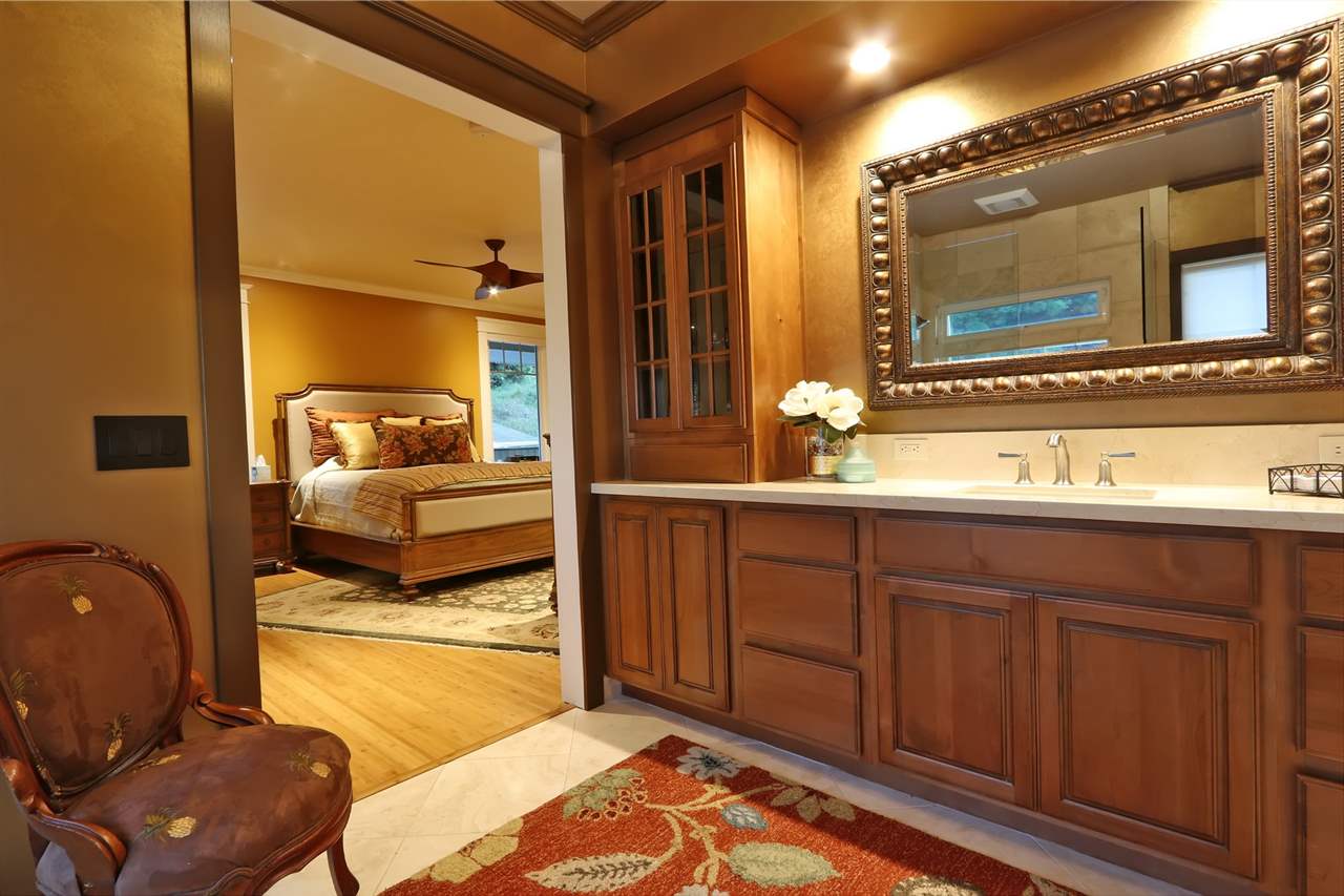 1268 Lower Kimo Drive Kula, HI 96790 - Photo 17 of 30 a en suite bathroom with a double vanity sink and a mirror