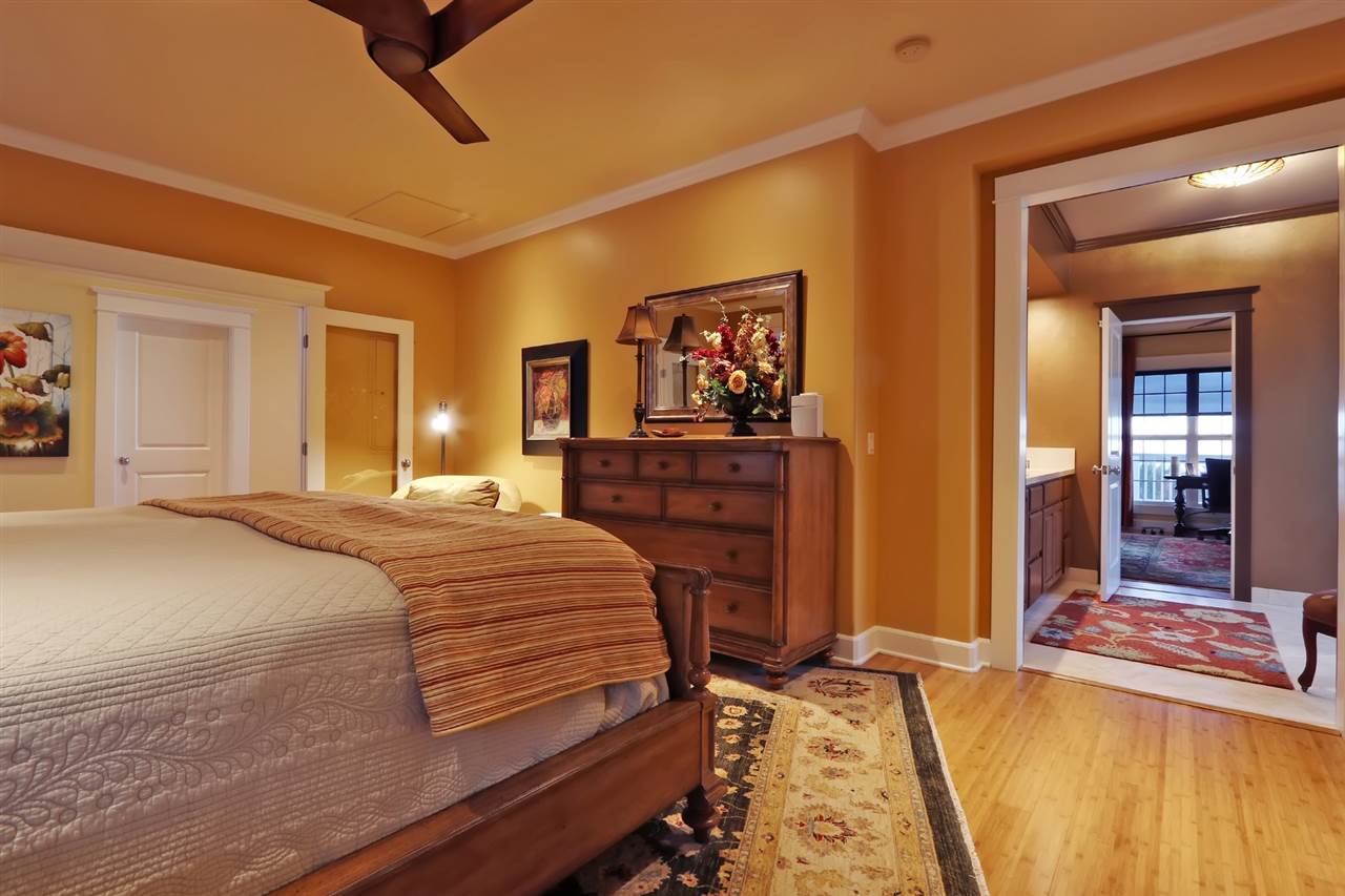 1268 Lower Kimo Drive Kula, HI 96790 - Photo 18 of 30 a bedroom with a bed and a flat screen tv