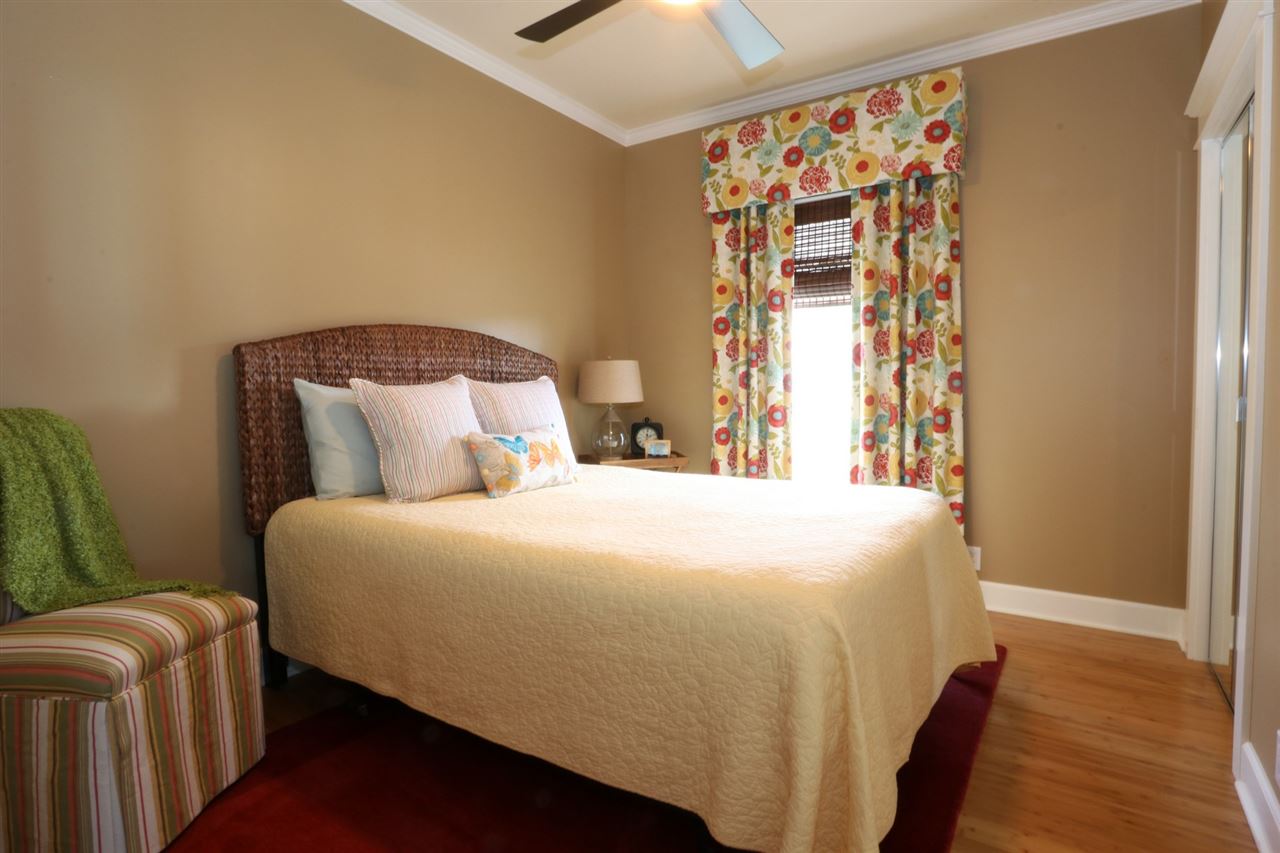 1268 Lower Kimo Drive Kula, HI 96790 - Photo 19 of 30 a bedroom with a bed and wooden floor