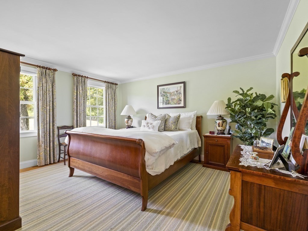 20 Jackson Road Sherborn, MA 01770 - Photo 12 of 29 a bedroom with bed and a potted plant