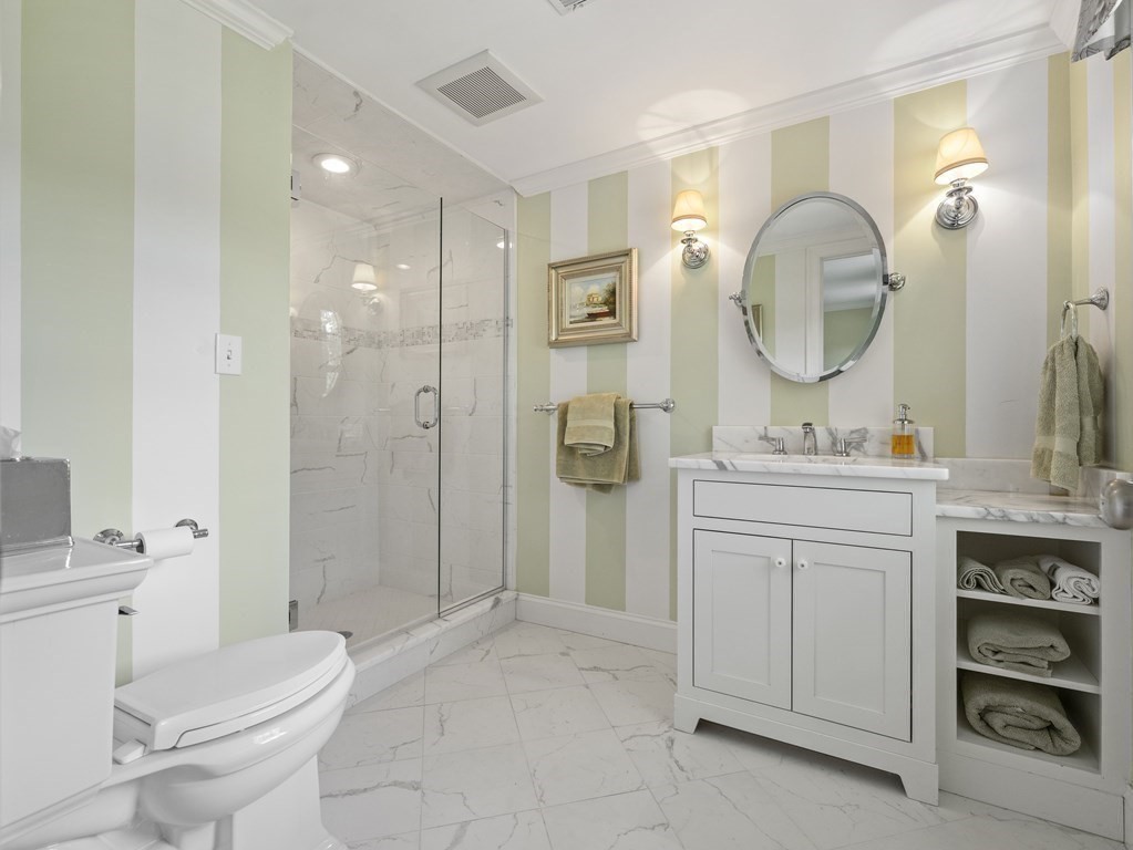 20 Jackson Road Sherborn, MA 01770 - Photo 13 of 29 a bathroom with a toilet a sink a mirror and vanity