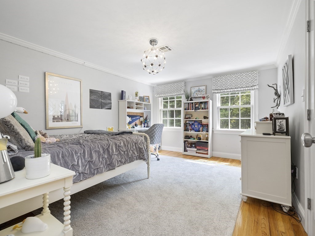 20 Jackson Road Sherborn, MA 01770 - Photo 15 of 29 a spacious bedroom with a bed and a wooden floor