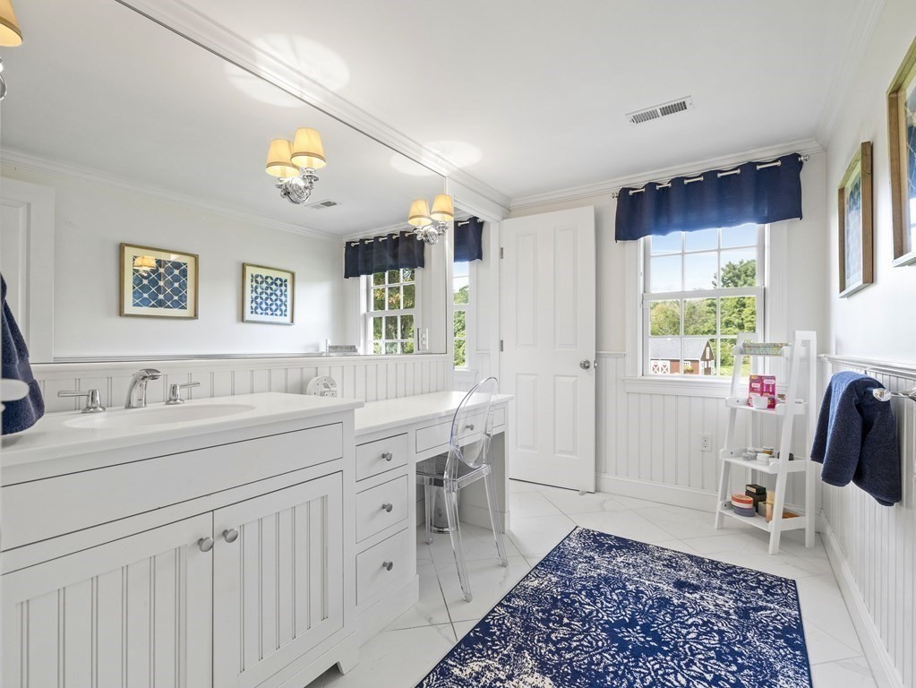 20 Jackson Road Sherborn, MA 01770 - Photo 16 of 29 a spacious bathroom with a double vanity sink a mirror a and a window