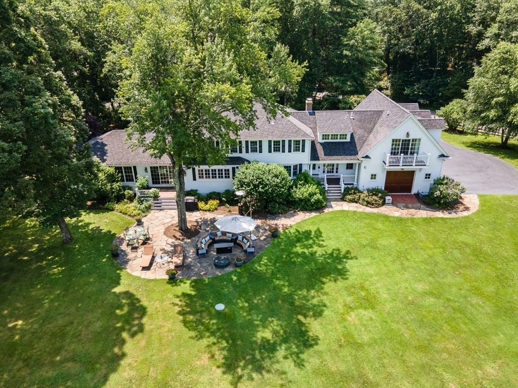20 Jackson Road Sherborn, MA 01770 - Photo 22 of 29 a front view of a house with garden and trees