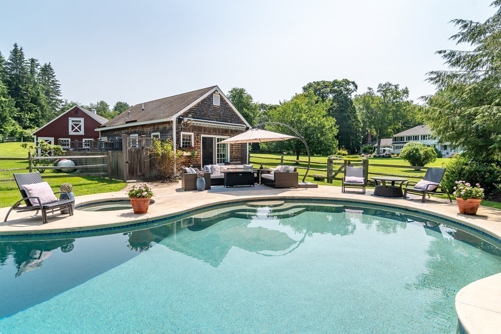 20 Jackson Road Sherborn, MA 01770 - Photo 23 of 29 a view of a house with swimming pool and a yard