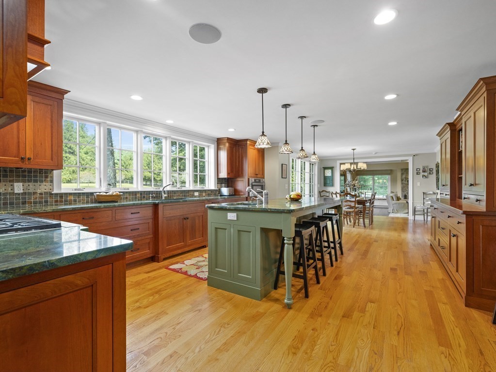 20 Jackson Road Sherborn, MA 01770 - Photo 3 of 29 a kitchen with a sink a counter top space a large window and stainless steel appliances