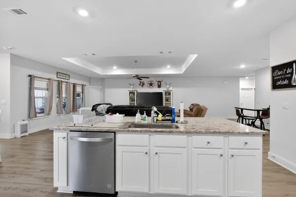 a kitchen with a sink and cabinets