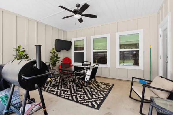 a living room with furniture and a window