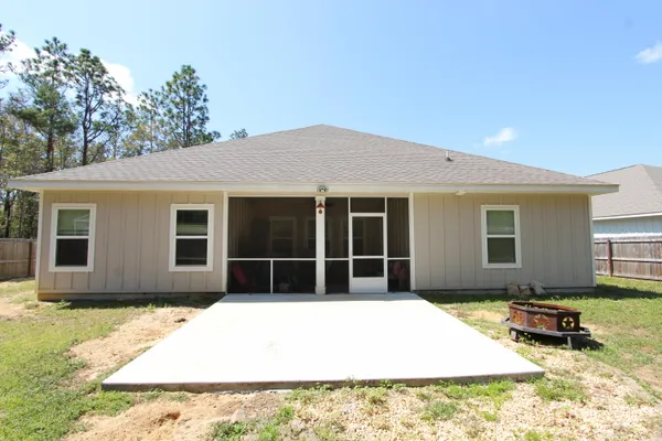 a house with trees in the background