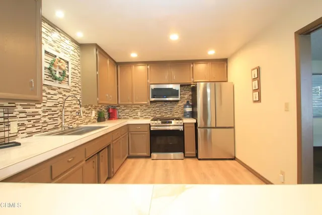 a view of a room with lots of wooden furniture