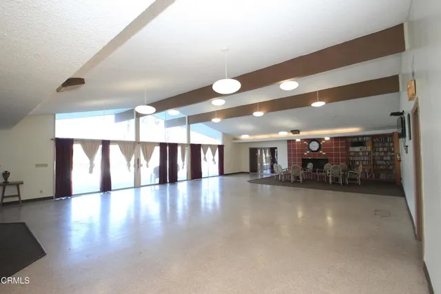 a dining room with furniture and a fireplace