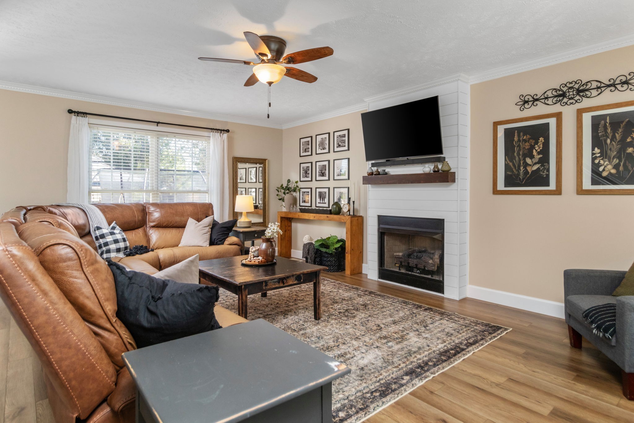 3572 Rabbit Run Trail Adams, TN 37010 - Photo 5 of 44 a living room with furniture a fireplace and a flat screen tv