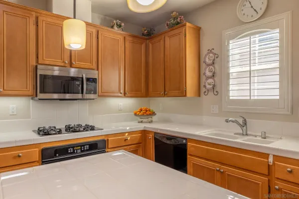 a kitchen with a stove and cabinets