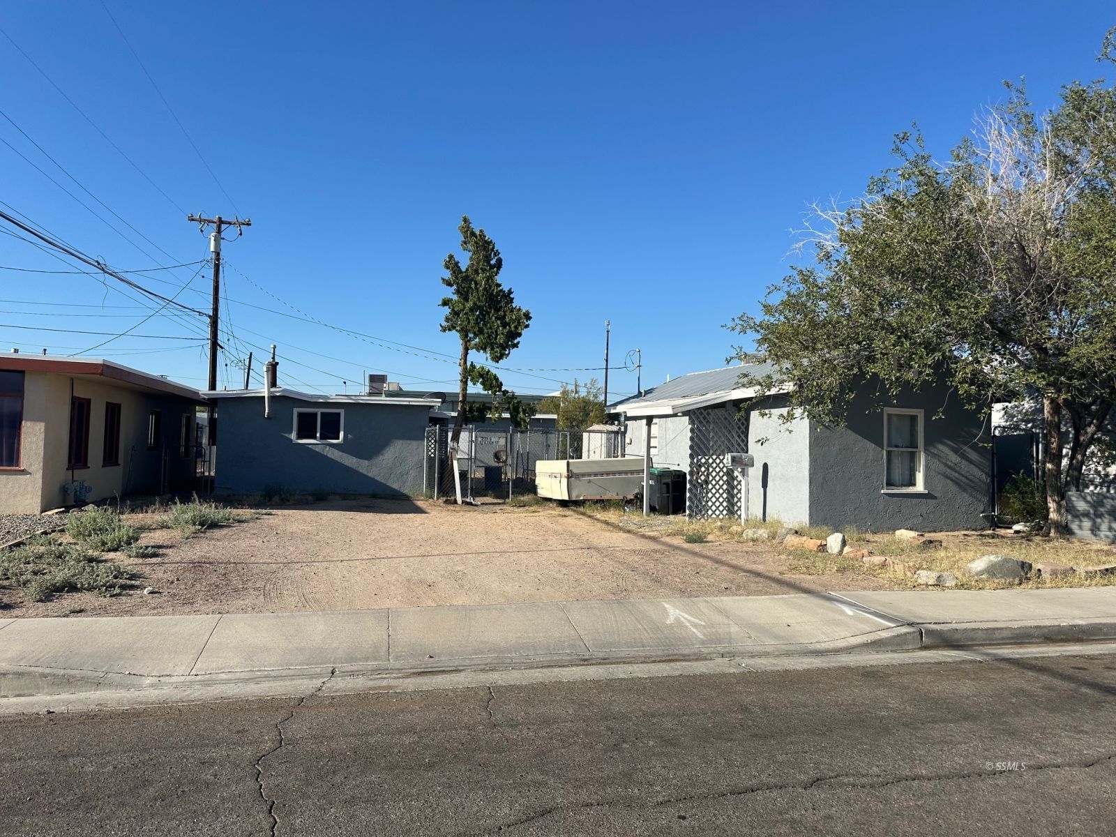 239 West Station Avenue Ridgecrest, CA 93555 - Photo 1 of 8 a view of a house with a snow on the road