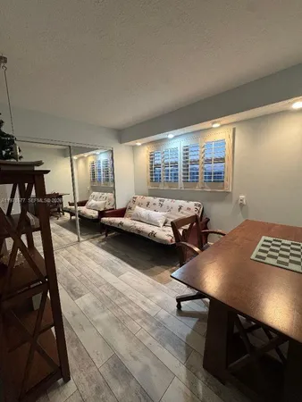 a view of a workspace with furniture and a livingroom