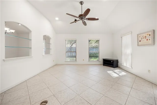 a view of an empty room with a window
