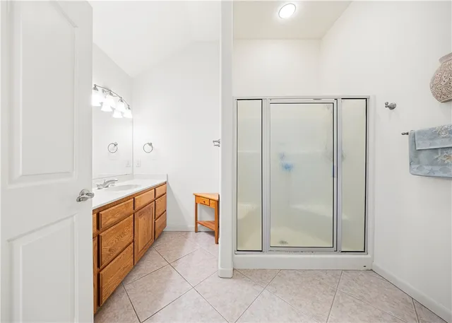 a view of a bathroom with tub shower and sink