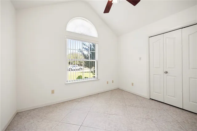 an empty room with windows and entrance