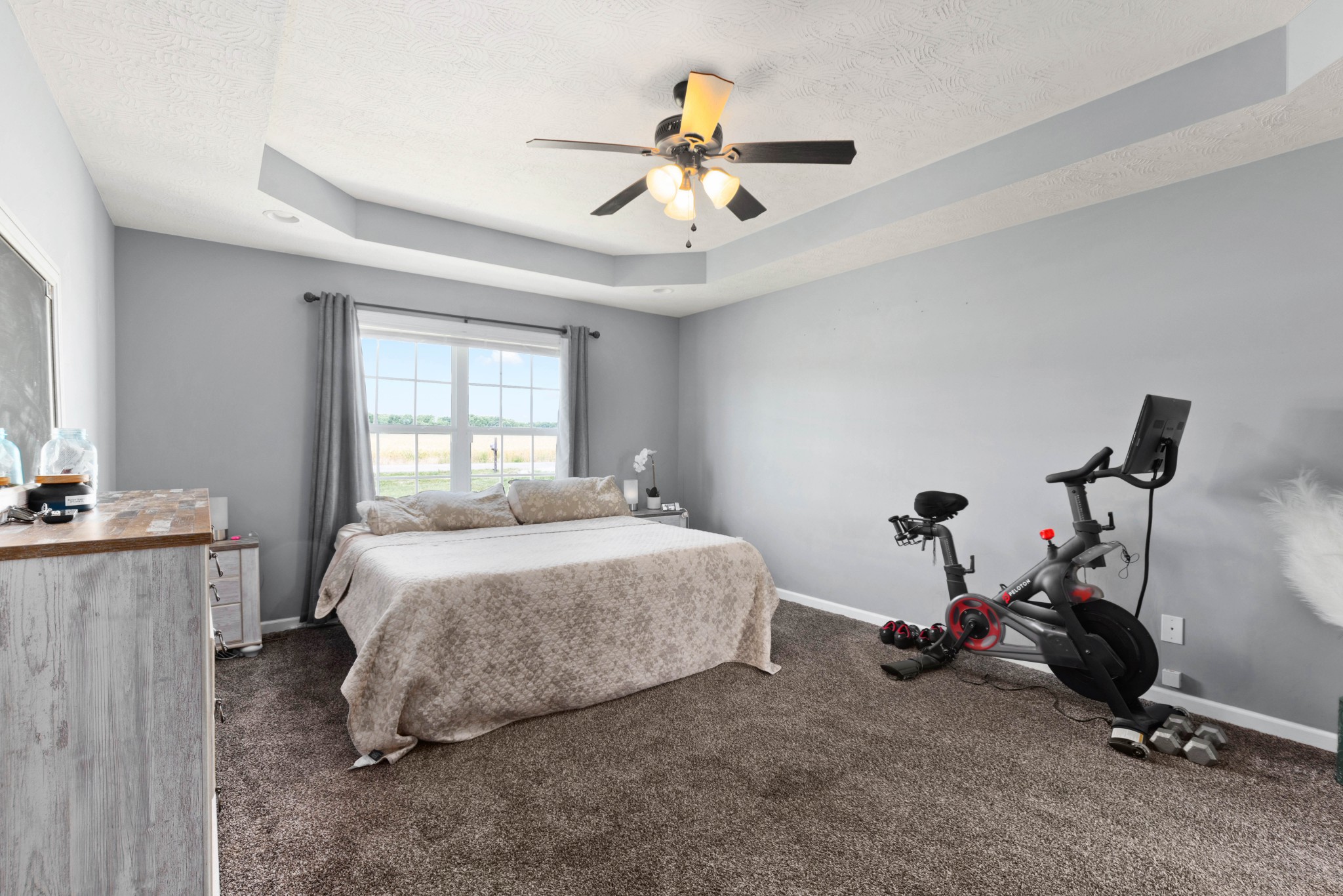 306 Meadows Road Portland, TN 37148 - Photo 12 of 31 a bedroom with a bed and a chandelier
