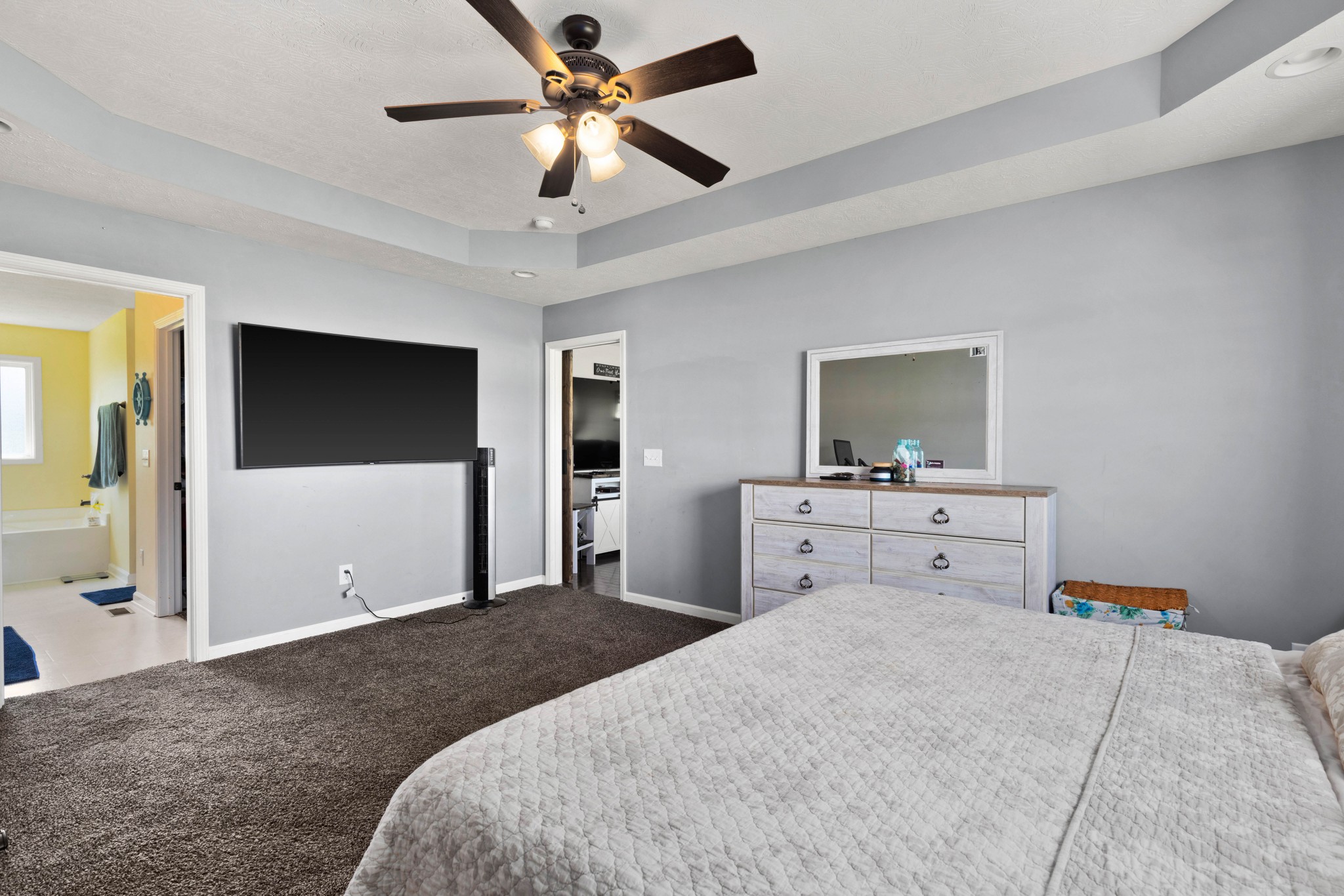 306 Meadows Road Portland, TN 37148 - Photo 14 of 31 a bedroom with a bed and a flat screen tv