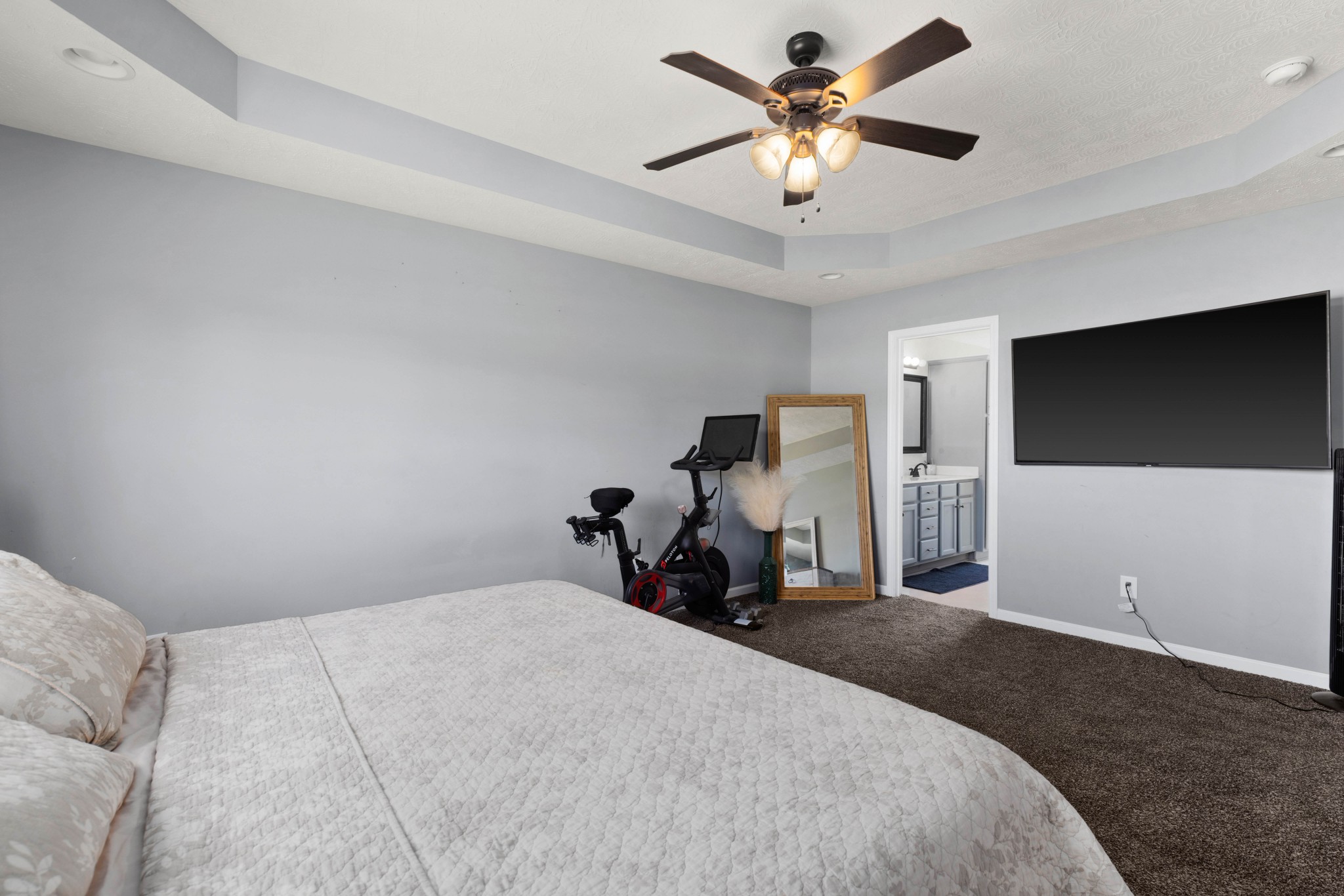 306 Meadows Road Portland, TN 37148 - Photo 15 of 31 a bedroom with a bed and a flat tv screen on the dresser