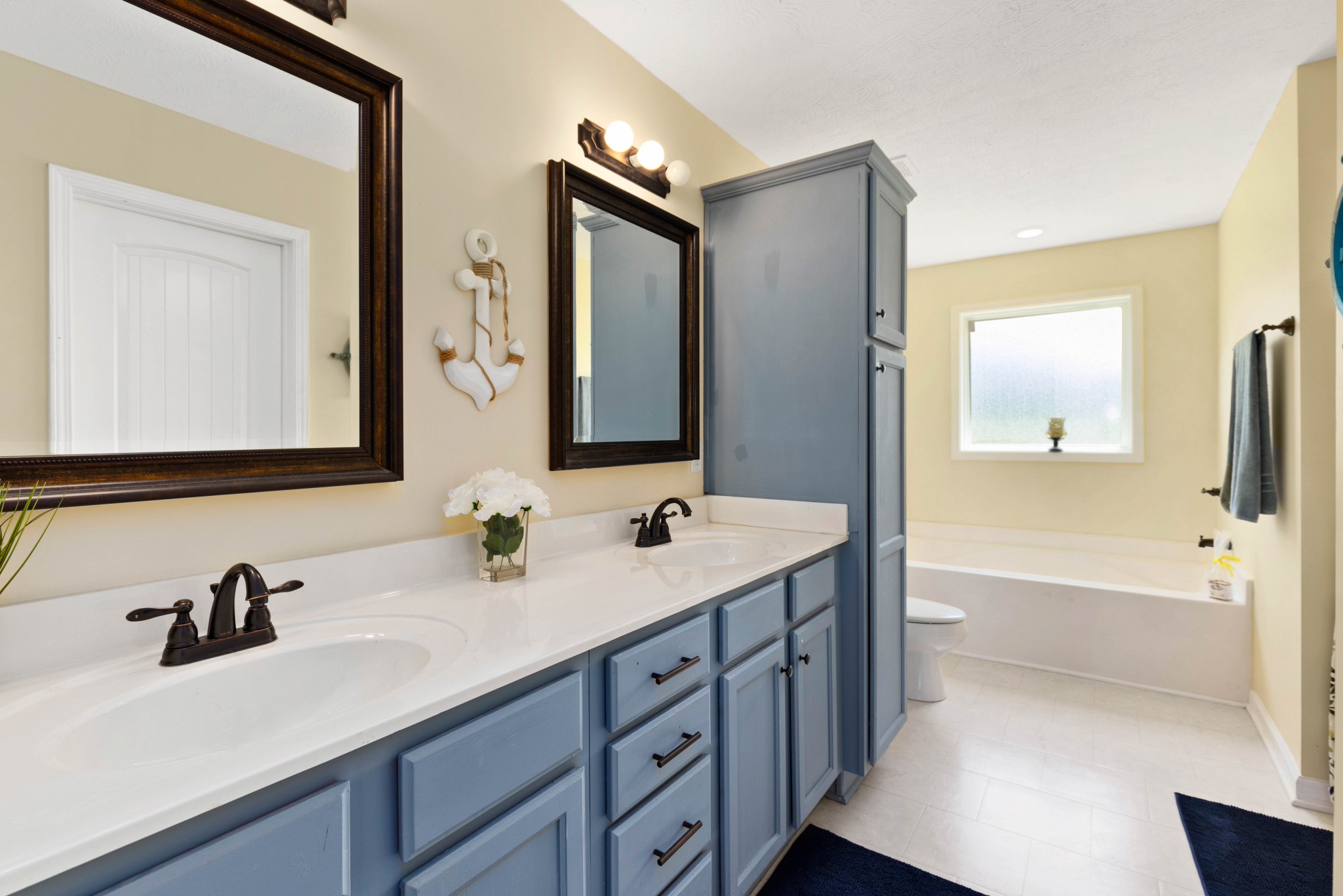 306 Meadows Road Portland, TN 37148 - Photo 17 of 31 a bathroom with a tub sink and mirror