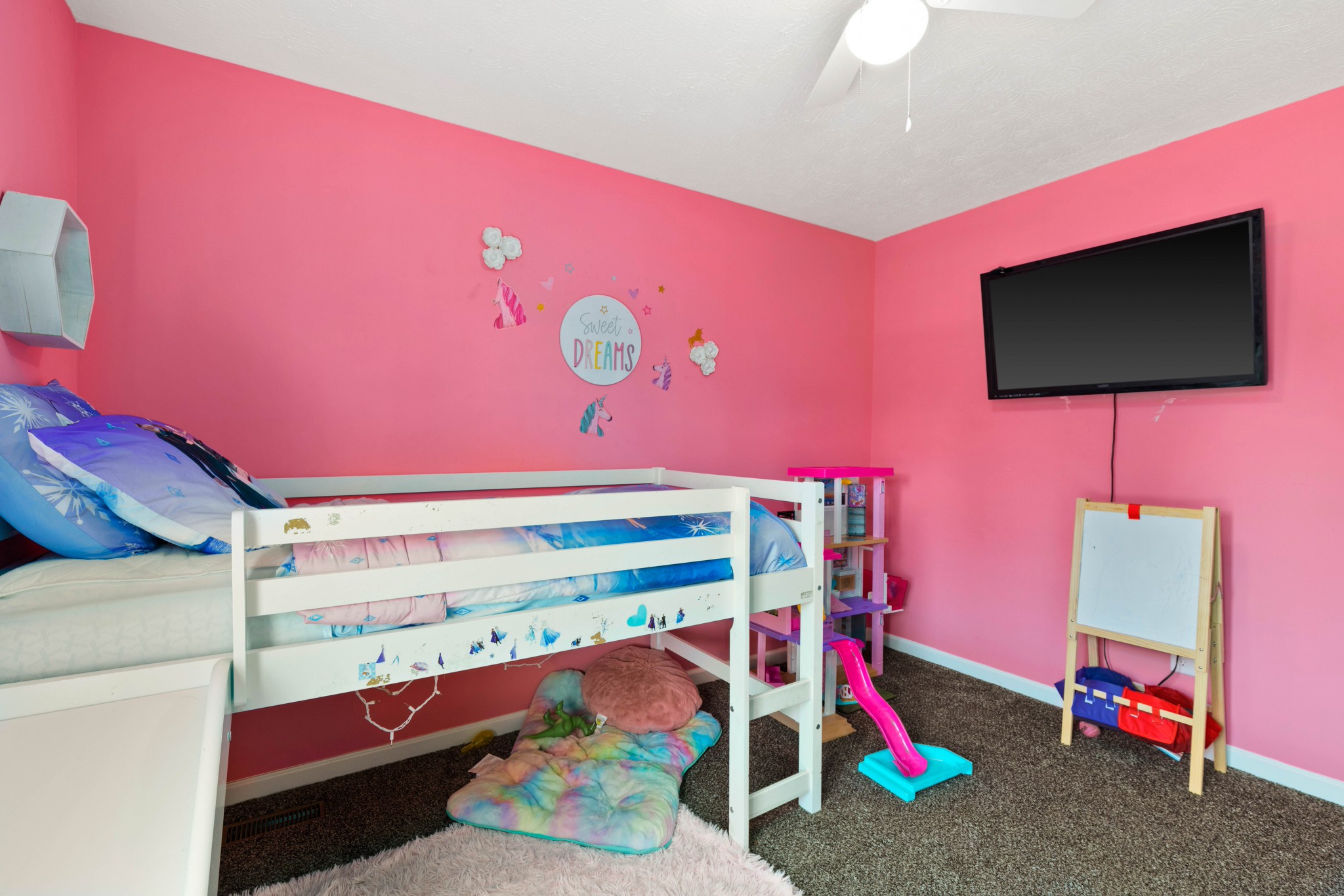 306 Meadows Road Portland, TN 37148 - Photo 24 of 31 a bedroom with furniture and a flat screen tv