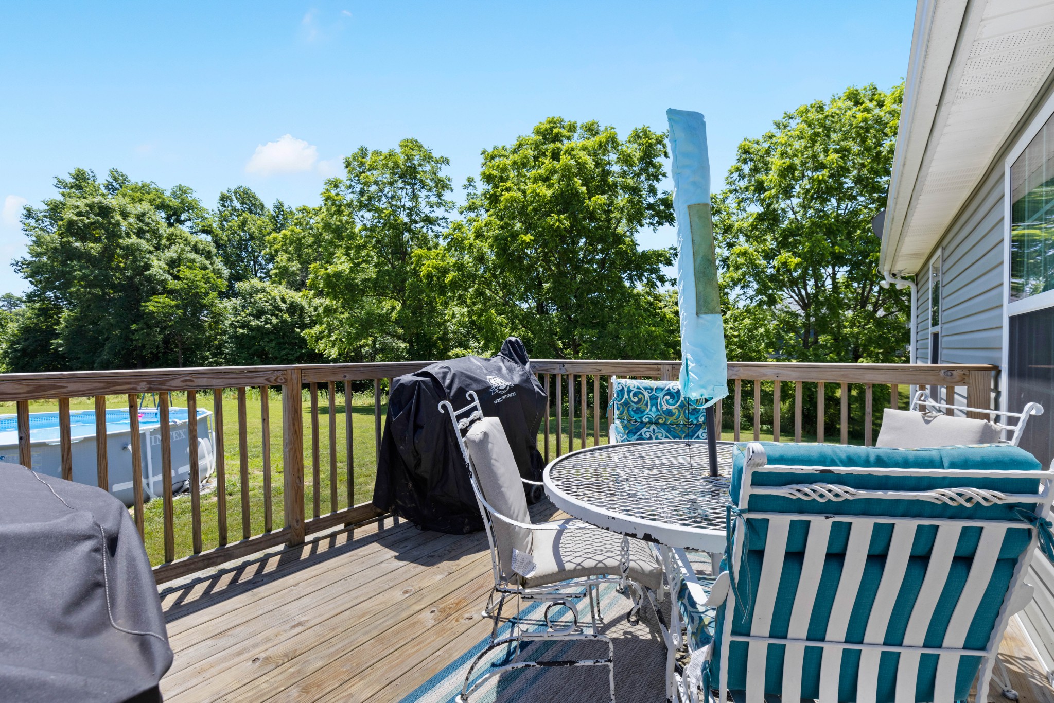 306 Meadows Road Portland, TN 37148 - Photo 25 of 31 a view of a deck with two chair and wooden floor