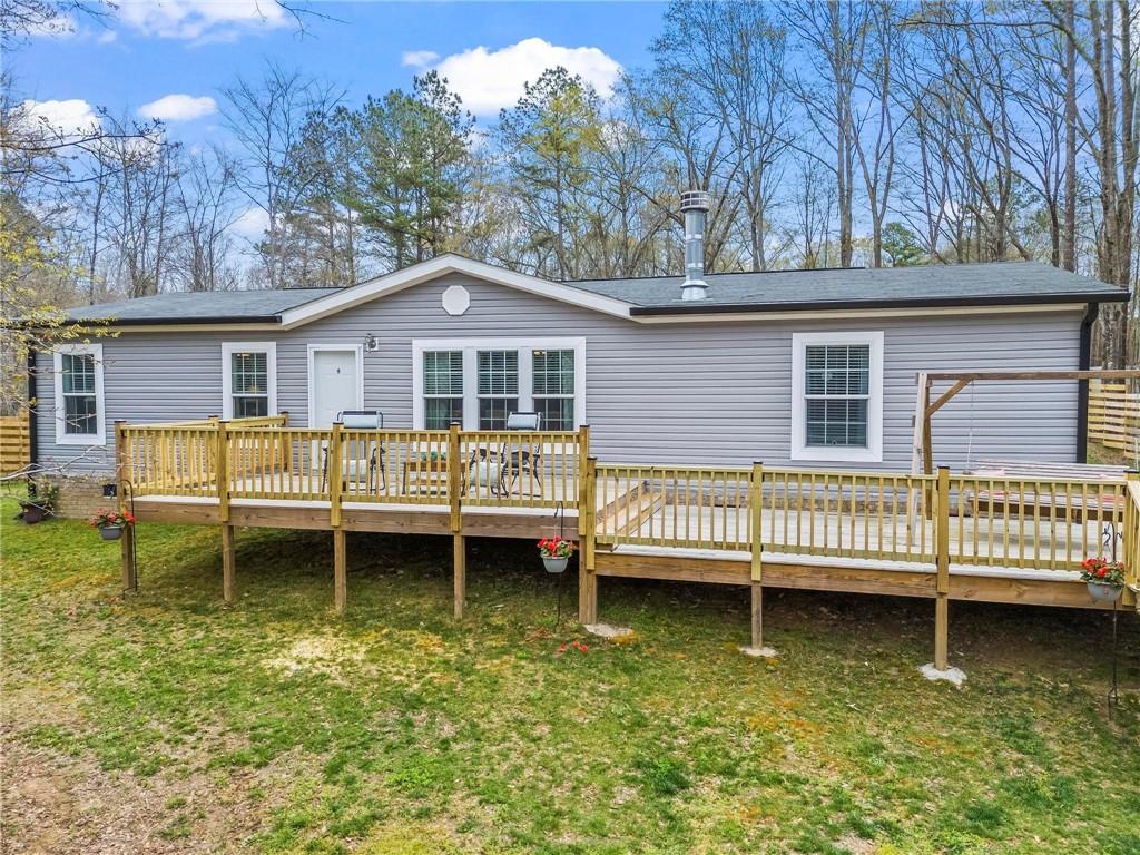 1361 Fraction Bottoms Road Buckhead, GA 30625 - Photo 1 of 1 a view of a house with a deck and a wooden deck