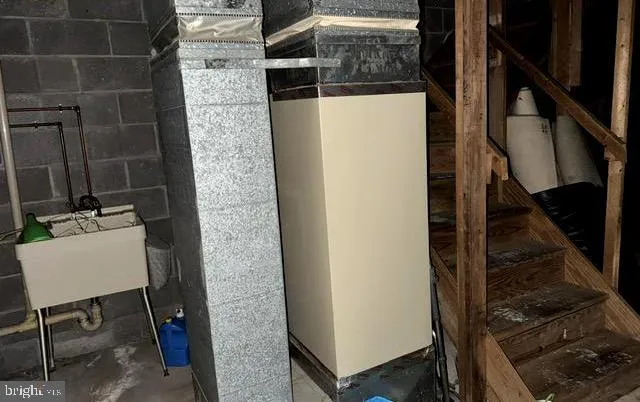 a bathroom with a sink toilet and a mirror