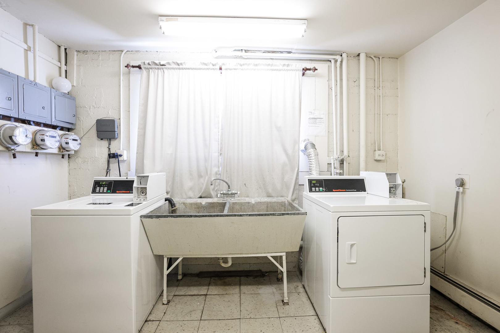 6850 Cermak Road, Unit 1B Berwyn, IL 60402 - Photo 9 of 9 a kitchen with a sink a stove and a refrigerator