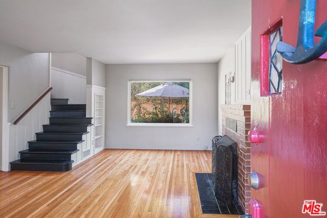 a view of entryway with wooden floor