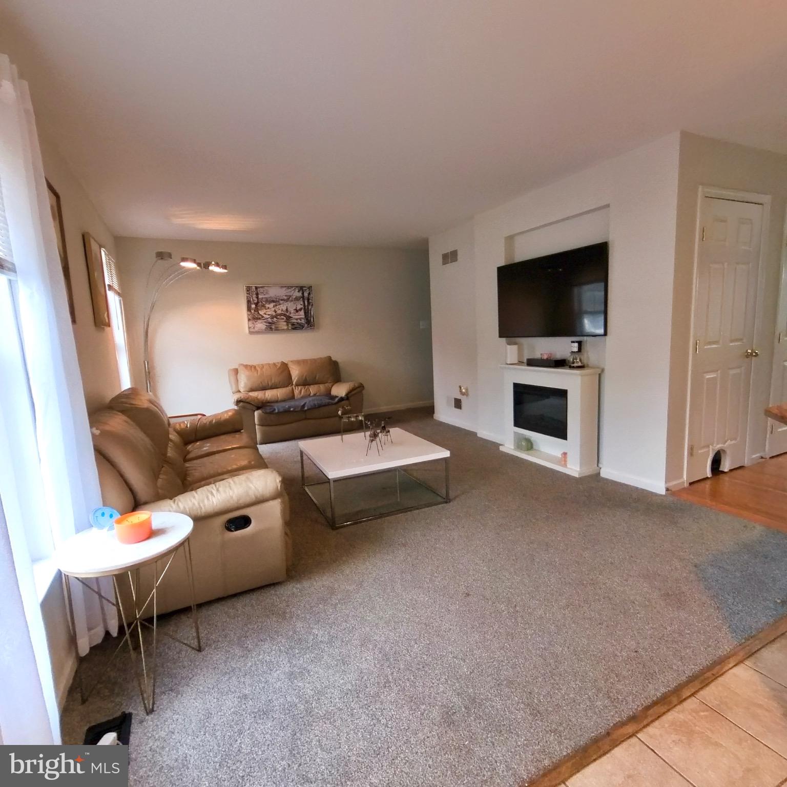 20 Mellowbrook Drive Reading, PA 19608 - Photo 11 of 39 a living room with furniture and a flat screen tv