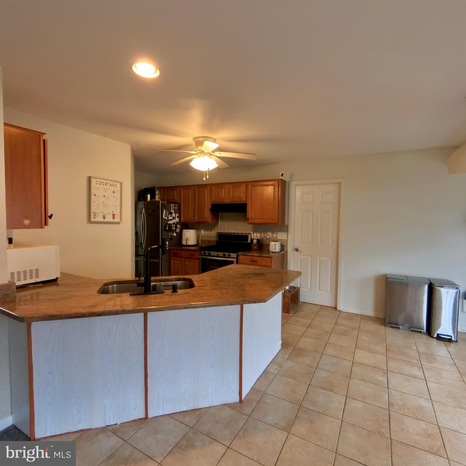 20 Mellowbrook Drive Reading, PA 19608 - Photo 13 of 39 a kitchen with stainless steel appliances granite countertop a sink and cabinets
