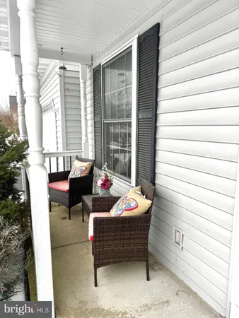 a outdoor living space with patio furniture and a potted plant