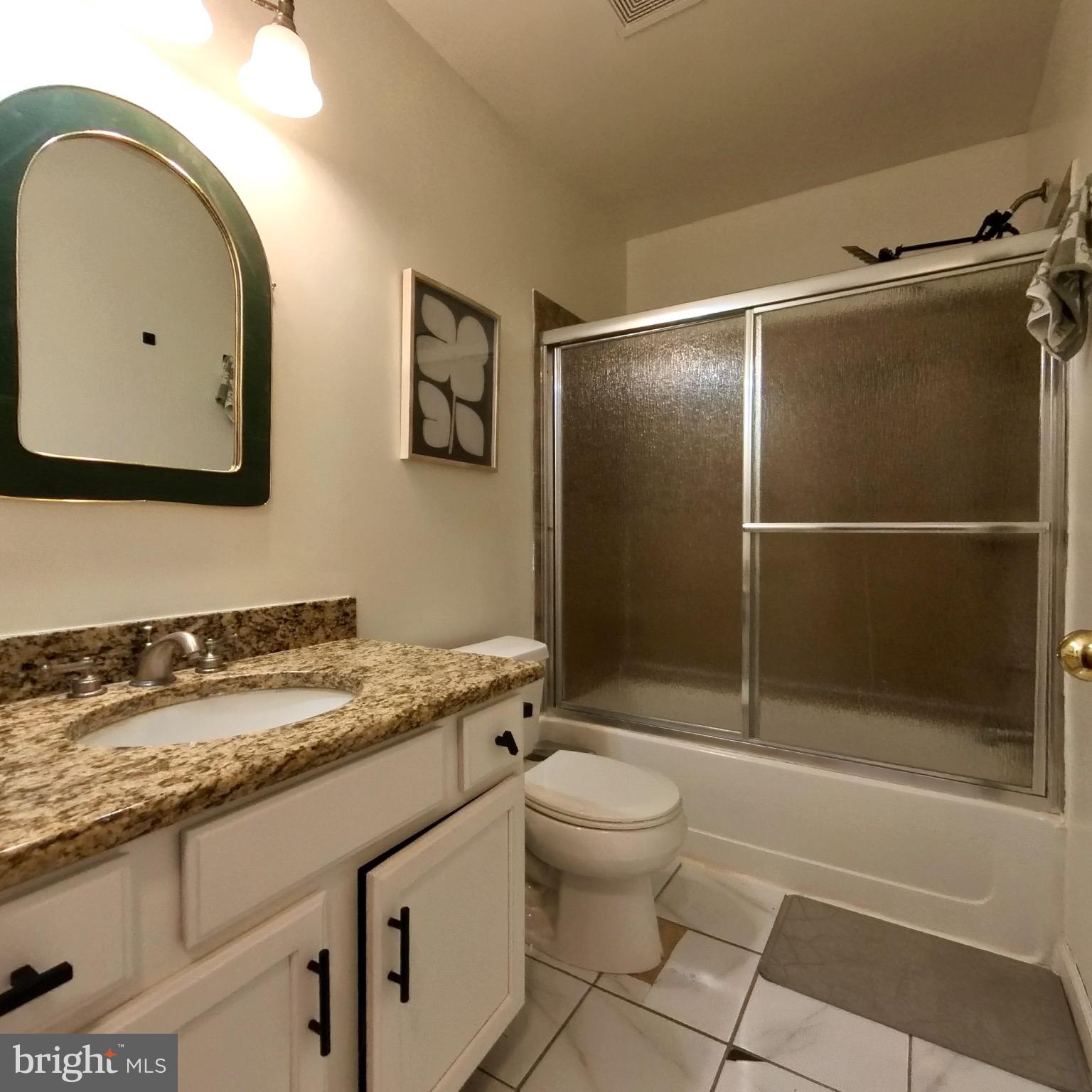 20 Mellowbrook Drive Reading, PA 19608 - Photo 27 of 39 a bathroom with a granite countertop sink a toilet and shower