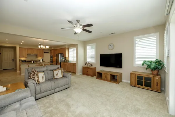 a bedroom with a bed couch and window