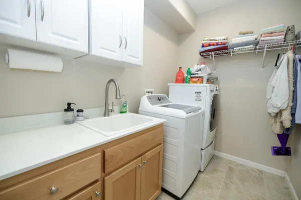 a bedroom with a bed a couch and dresser