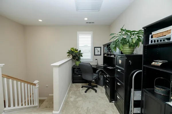 a bathroom with a granite countertop shower and a mirror