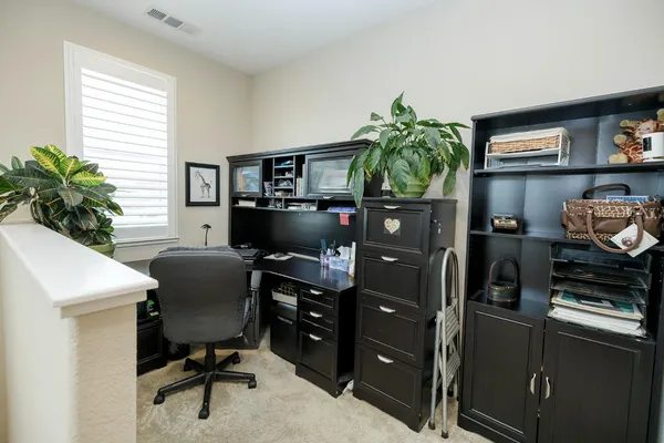 a spacious bathroom with a double vanity sink double mirror and toilet