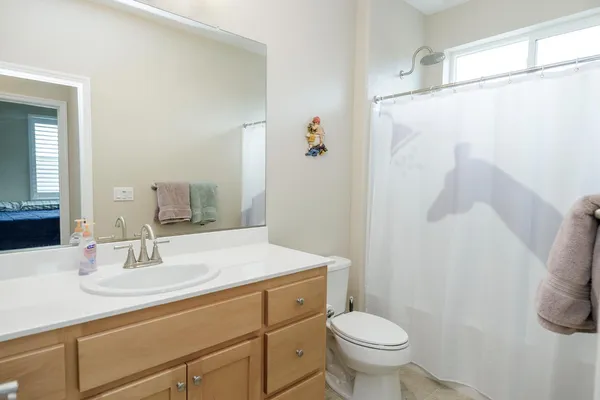 a view of a porch with furniture and a yard