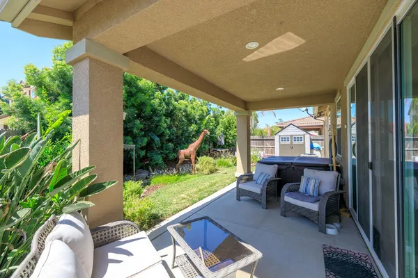 a view of house with yard outdoor seating