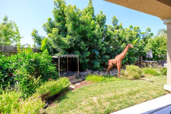 a swimming pool with outdoor seating and yard