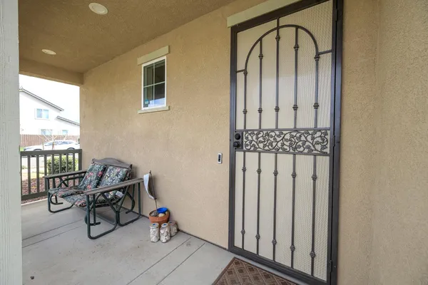 a large kitchen with granite countertop a large counter top stainless steel appliances and cabinets