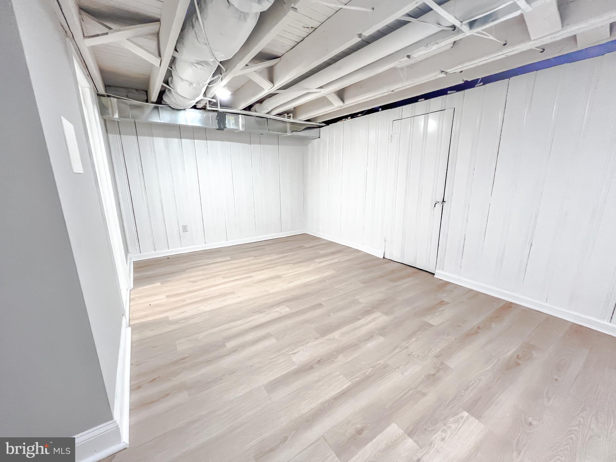 3204 Sequoia Avenue Baltimore, MD 21215 - Photo 11 of 19 a view of empty room with wooden floor