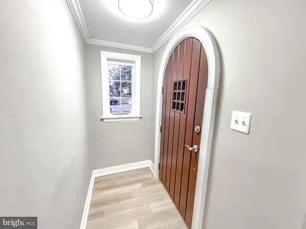 a view of front door with wooden floor