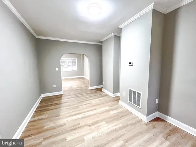 a view of wooden floor and a living room