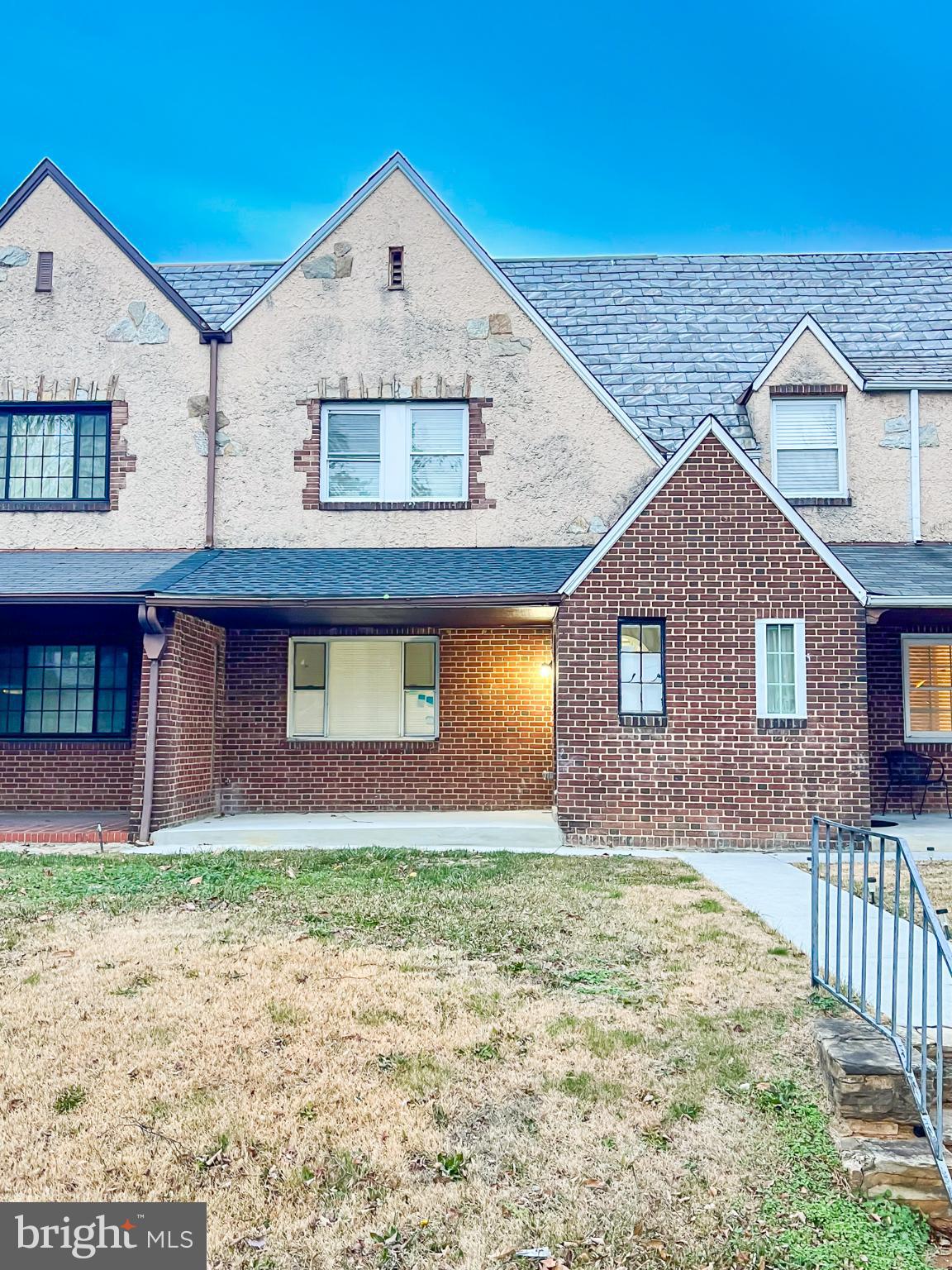 3204 Sequoia Avenue Baltimore, MD 21215 - Photo 2 of 19 a front view of a house with a yard and garage